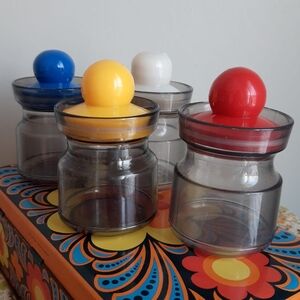 Set of 4 Clear Retro Jars with Colorful Knob Lids - Blue, Yellow, White, Red